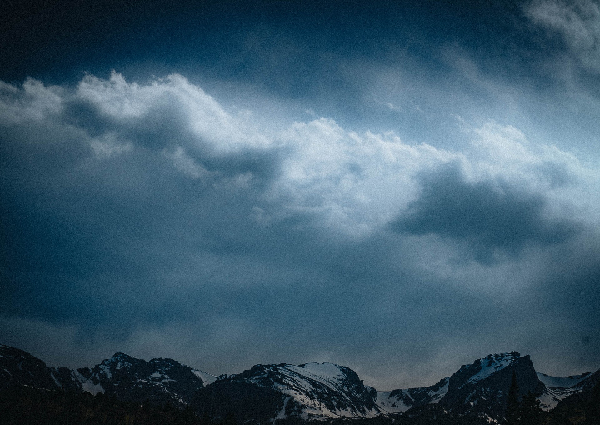 Misty mountain range at blue hour, cinematic wide still